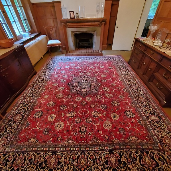 Kashan rug sold in use at client's house