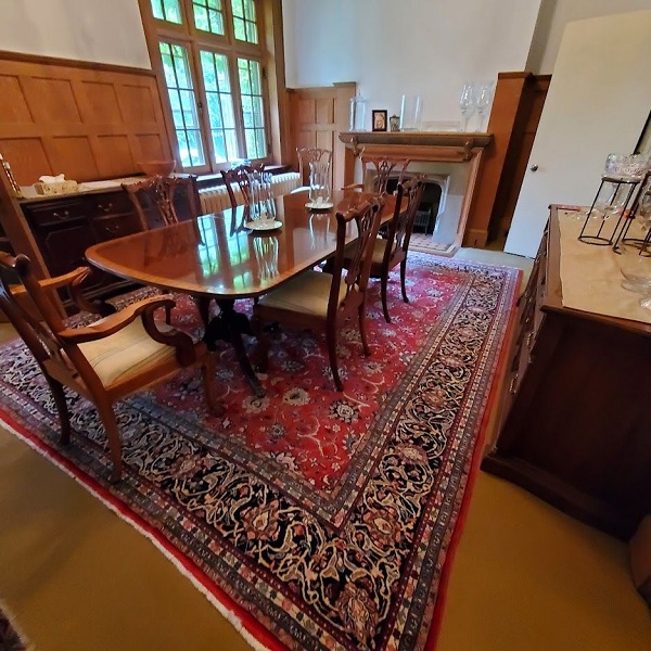 Kashan rug at client's house under dining table