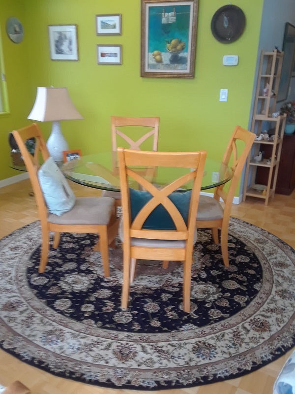 round wool rug sold at client's house with some furniture