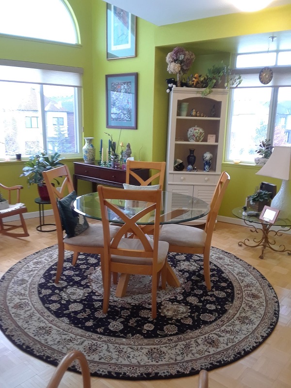 round wool rug sold at client's house with some furniture