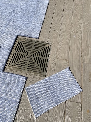 A piece after cutting and binding the rug for terrace to fit the water drain