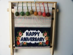 Happy Anniversary letters in English on a rug