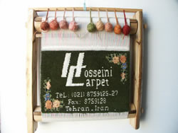 Hoseeini Logo on a rug