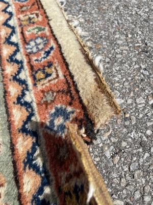 Front View of Cut Damage on Handmade Rug